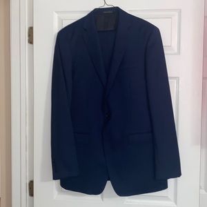 Includes both suit jacket and pants. The brand is Calvin Klein